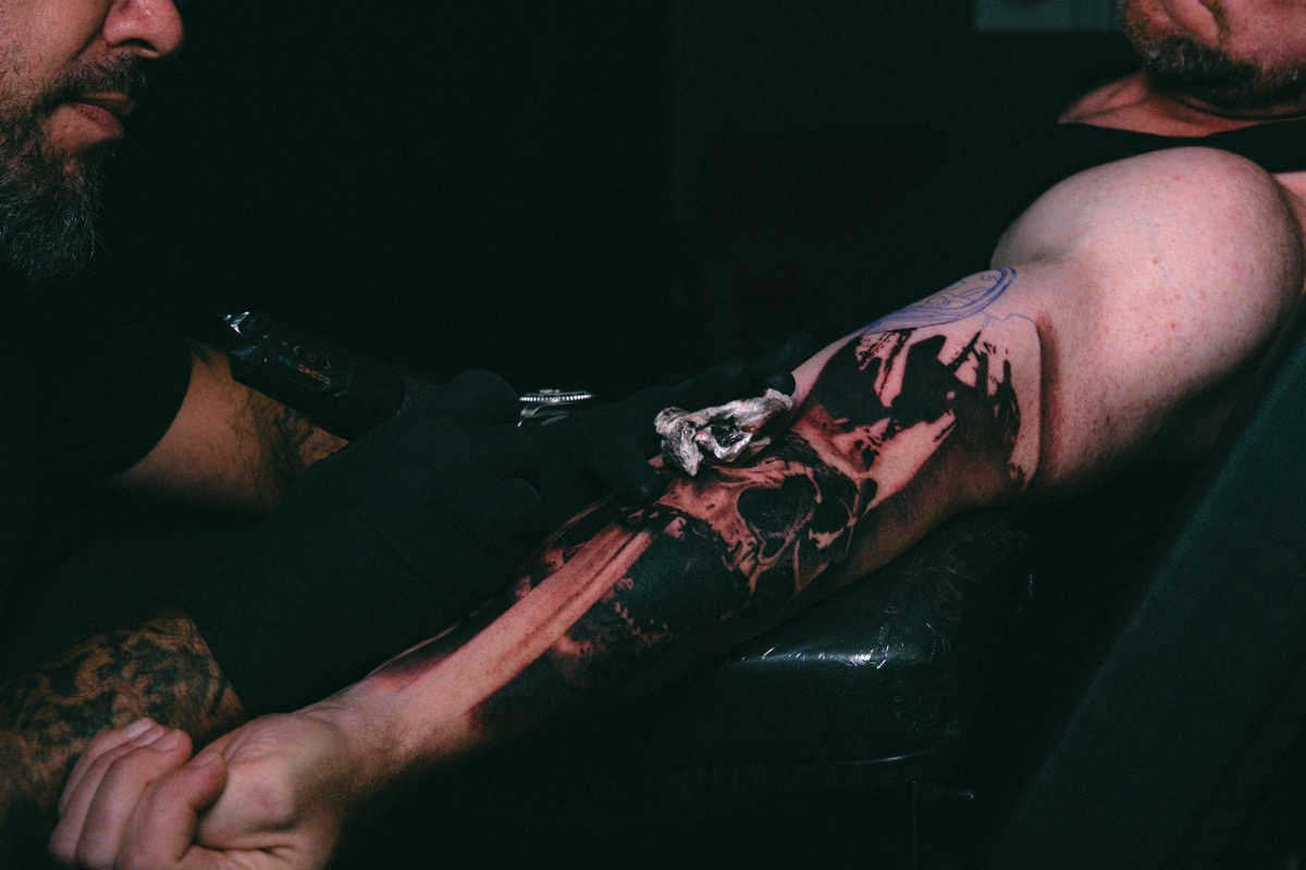The piece taking shape on the forearm, black laid in first